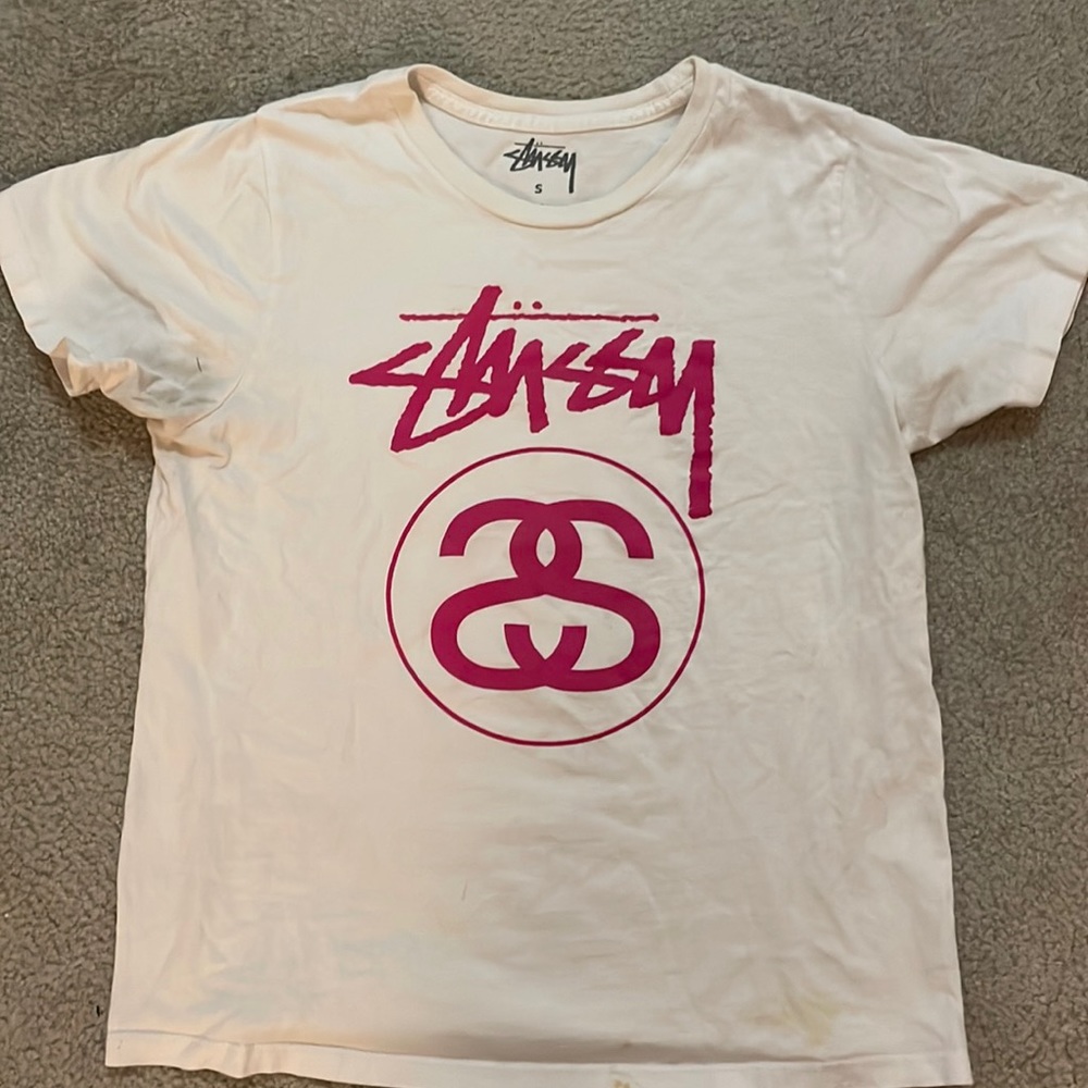 Women’s short sleeve Stussy T-shirt with pink logo.